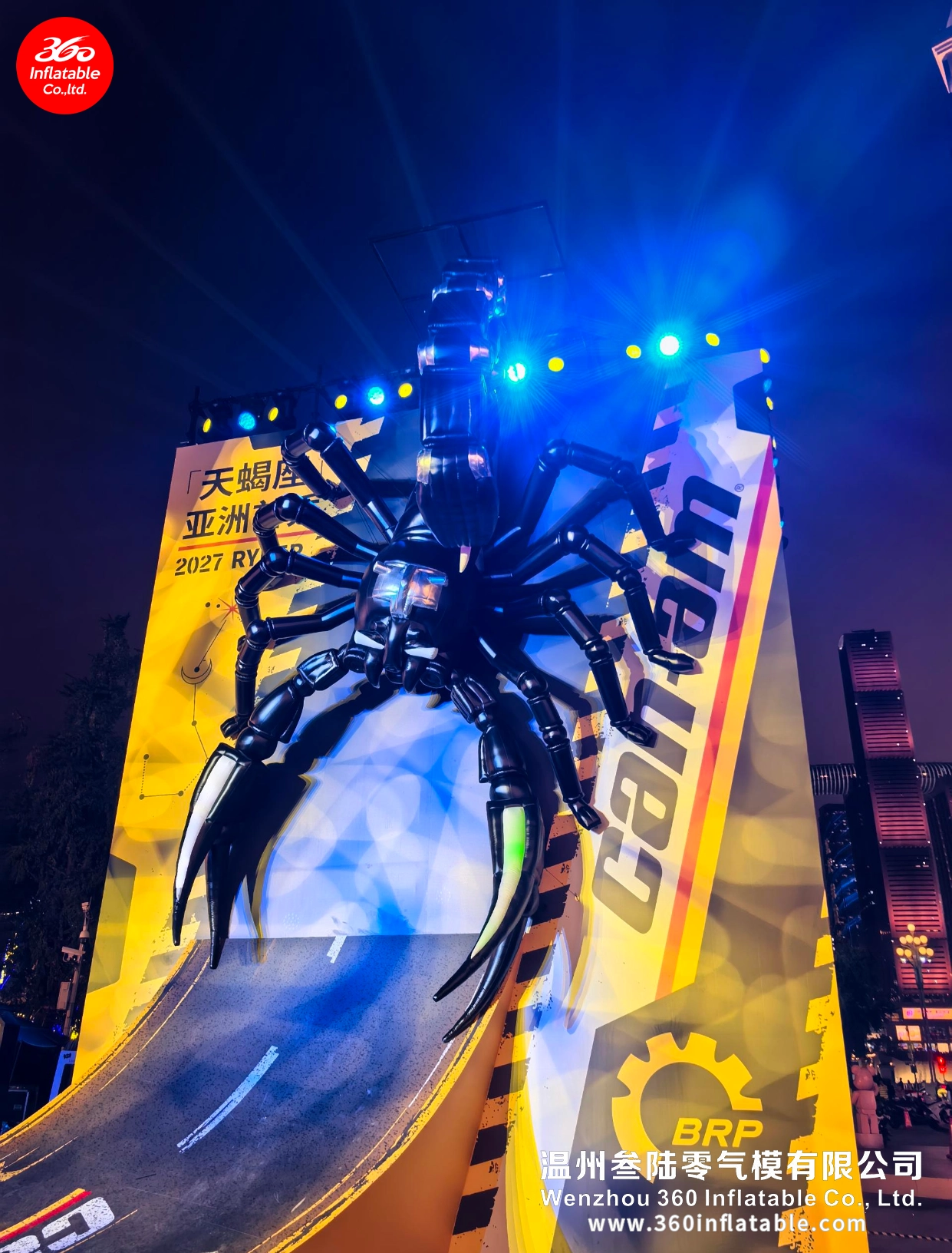 Night panoramic view of the BRP Can-Am Ryker Scorpio mechanical inflatable in front of a clock tower during the Asia Premiere event.