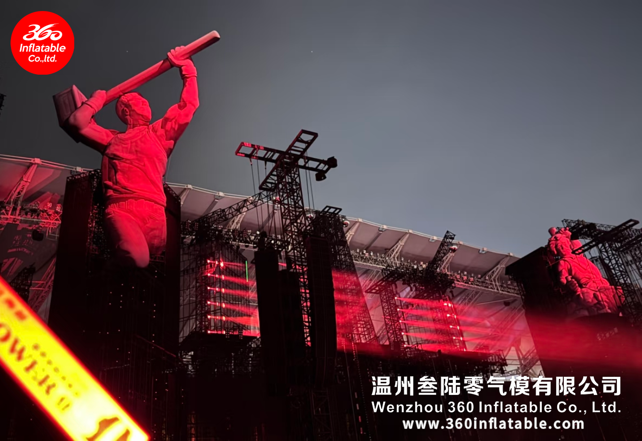 Large artist-themed inflatable sculptures at Tao Zhe’s concert, creating a solid sculptural appearance under stage lighting